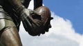 Commemorative statue of Jim Stynes Melbourne Demons legend holding the footy