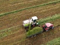 Forage harvester during grass cutting for silage in field. Harvesting biomass crop. Self-propelled Harvester for agriculture Royalty Free Stock Photo