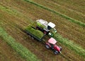 Forage harvester during grass cutting for silage in field. Harvesting biomass crop. Self-propelled Harvester for agriculture Royalty Free Stock Photo