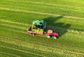 Forage harvester during grass cutting for silage in field. Harvesting biomass crop. Self-propelled Harvester for agriculture Royalty Free Stock Photo