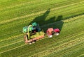 Forage harvester during grass cutting for silage in field. Harvesting biomass crop. Self-propelled Harvester for agriculture Royalty Free Stock Photo