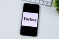 Forbes Magazine app logo on a smartphone screen. Royalty Free Stock Photo