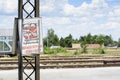 Forbidden running across the railway tracks sign Royalty Free Stock Photo