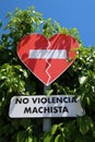 Forbidden sign in the shape of a heart with the text NO SEXIST VIOLENCE Royalty Free Stock Photo