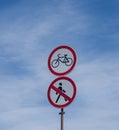 forbidding road signs on a blue sky background Royalty Free Stock Photo