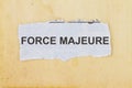 Force Majeure newspaper cut out with a vintage paper background Royalty Free Stock Photo