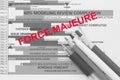 Force majeure red color word overlay on a manufacturing schedule Royalty Free Stock Photo