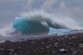 force of nature, a wave crashes on a glacier