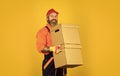 Forced to move. Man courier hold boxes. Prepare for moving. Rent house. Hipster moving out. Moving routine. Packaging Royalty Free Stock Photo