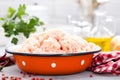 Forcemeat. Raw ground chicken meat in bowl on white kitchen table. Fresh minced chicken breast meat Royalty Free Stock Photo