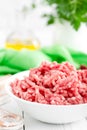 Forcemeat. Raw ground pork meat in bowl on white kitchen table. Fresh minced meat Royalty Free Stock Photo