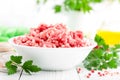 Forcemeat. Raw ground pork meat in bowl on white kitchen table. Fresh minced meat