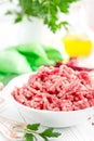 Forcemeat. Raw ground pork meat in bowl on white kitchen table. Fresh minced meat Royalty Free Stock Photo