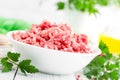 Forcemeat. Raw ground pork meat in bowl on white kitchen table. Fresh minced meat Royalty Free Stock Photo