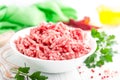 Forcemeat. Raw ground pork meat in bowl on white kitchen table. Fresh minced meat Royalty Free Stock Photo