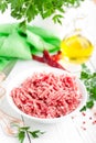 Forcemeat. Raw ground pork meat in bowl on white kitchen table. Fresh minced meat Royalty Free Stock Photo