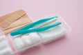 Forceps, plasters, cotton ball, gauze  Sterile dressing set  on pink background. First aid kit at home, healthcare and medical Royalty Free Stock Photo