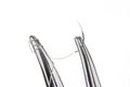 Forceps with suture kit