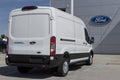 Ford E-Transit Cargo Van display at a dealership. Ford offers the E-Transit in Cargo Van, Chassis Cab or Cutaway models