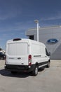 Ford E-Transit Cargo Van display at a dealership. Ford offers the E-Transit in Cargo Van, Chassis Cab or Cutaway models