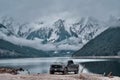 Ford F150 car parked at the lake on the background of breathtaking snowy mountains