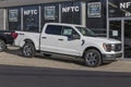 Ford F-150 display at a dealership. The Ford F150 is available in XL, XLT, Lariat, King Ranch, Platinum, and Limited models Royalty Free Stock Photo