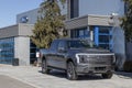 Ford F-150 Lightning display. Ford offers the F150 Lightning all-electric truck in Pro, XLT, Lariat, and Platinum models Royalty Free Stock Photo