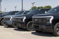 Ford F-150 Lightning display. Ford offers the F150 Lightning all-electric truck in Pro, XLT, Lariat, and Platinum models Royalty Free Stock Photo