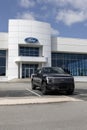 Ford F-150 Lightning display. Ford offers the F150 Lightning all-electric truck in Pro, XLT, Lariat, and Platinum models Royalty Free Stock Photo