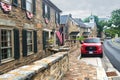 Ford F-150 pickup truck is parked on the side of the road in an ancient city