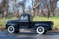 1949 Ford F1 Utility driving on country road