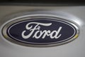 Ford logo on a grey car, an American multinational automaker