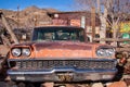 Ford Mercury salvage on a backyard of a store at a route 66