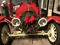 1907 Ford Model K Touring Car with a red holiday wreath and bo