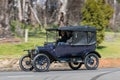 1915 Ford Model T Tourer driving on country road