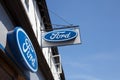 The Ford motor car logo at a car showroom in the UK