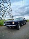 1966 Ford Mustang CoupÃÂ© beneath power lines