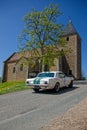 Ford Mustang and the church during Tour Auto