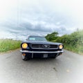 1966 Ford Mustang CoupÃÂ© beneath power lines