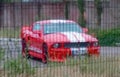 Red body color with blue stripes Ford Mustang on the parking Royalty Free Stock Photo