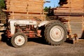 Ford N Series tractor by a sawmill Royalty Free Stock Photo