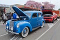 A 1949 Ford Prefect at an outdoor car show