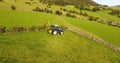 Ford tractor cutting hedges on a farm UK 5th May `21
