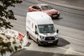 Ford Transit Fourth generation in the city street. Front side view of white light commercial vehicle with logo Velobike Royalty Free Stock Photo