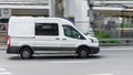 Ford Transit Fourth generation in the city street. Side view of white light commercial vehicle Royalty Free Stock Photo