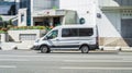 Ford Transit speeding on road. White passenger Ford Transit van in motion Royalty Free Stock Photo