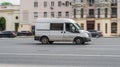 Ford Transit Third generation in the city street. Side view of white panel van, light commercial vehicle Royalty Free Stock Photo