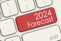 2024 forecast word on red laptop keyboard