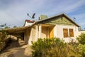 Foreclosed Home With Boarded Up Doors & Windows