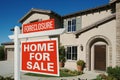 Foreclosure Home For Sale Sign in Front of House Royalty Free Stock Photo